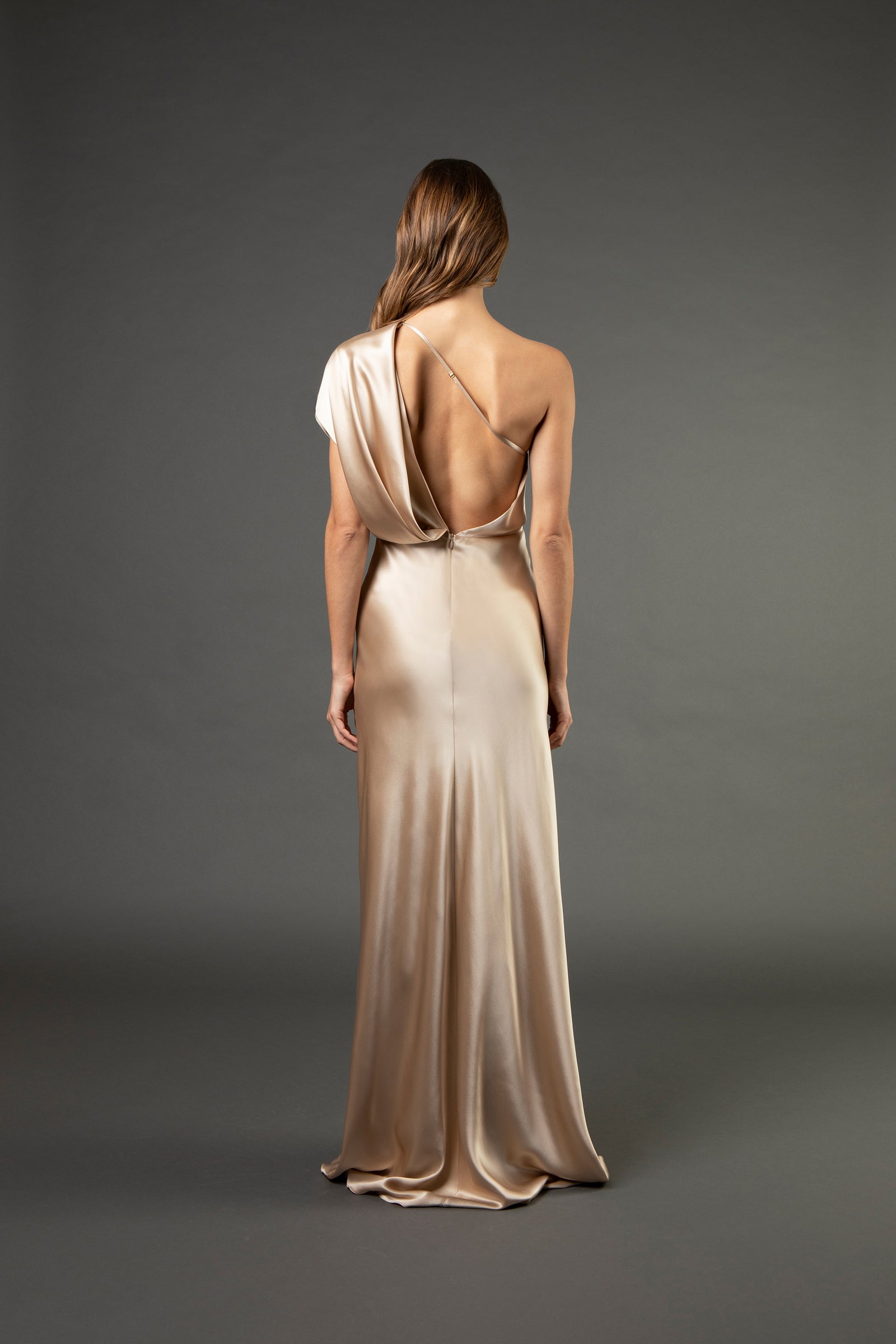 Asymmetrical open back draped gown